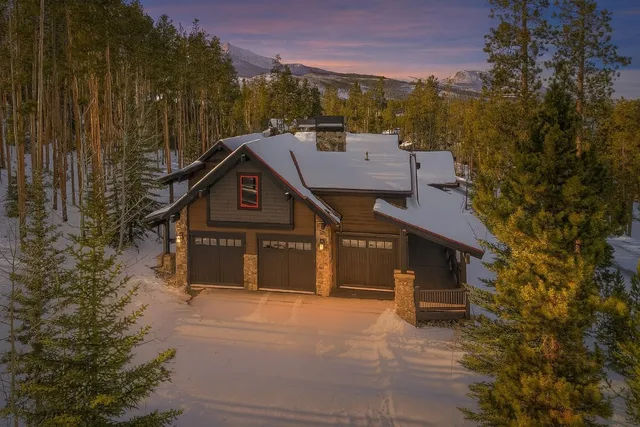 a aerial view of a house with a yard
