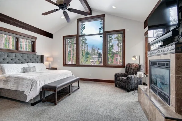 a spacious bedroom with a bed and a couch