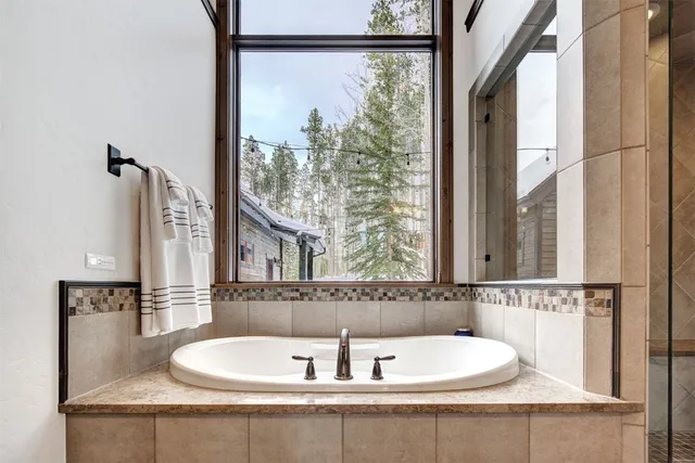 a bathroom with a bathtub and a sink