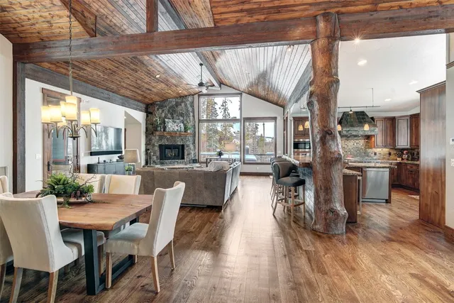 a view of a dining room with furniture wooden floor and chandelier