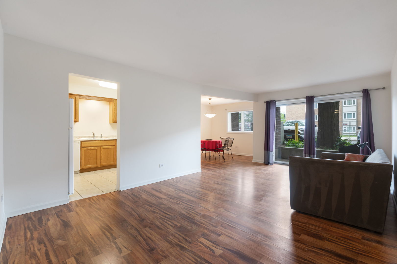 435 Ridge Road, Unit 108 Wilmette, IL 60091 - Photo 4 of 18 a view of a livingroom with wooden floor and furniture