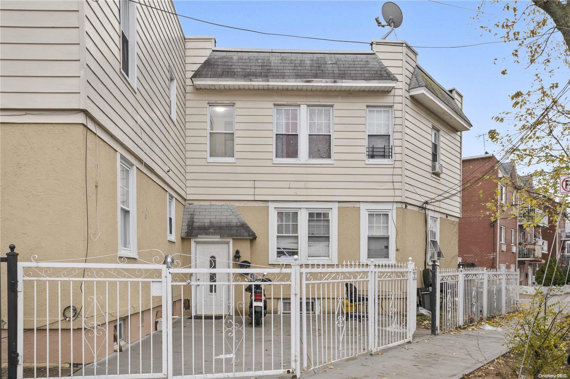 a view of a house with a small yard