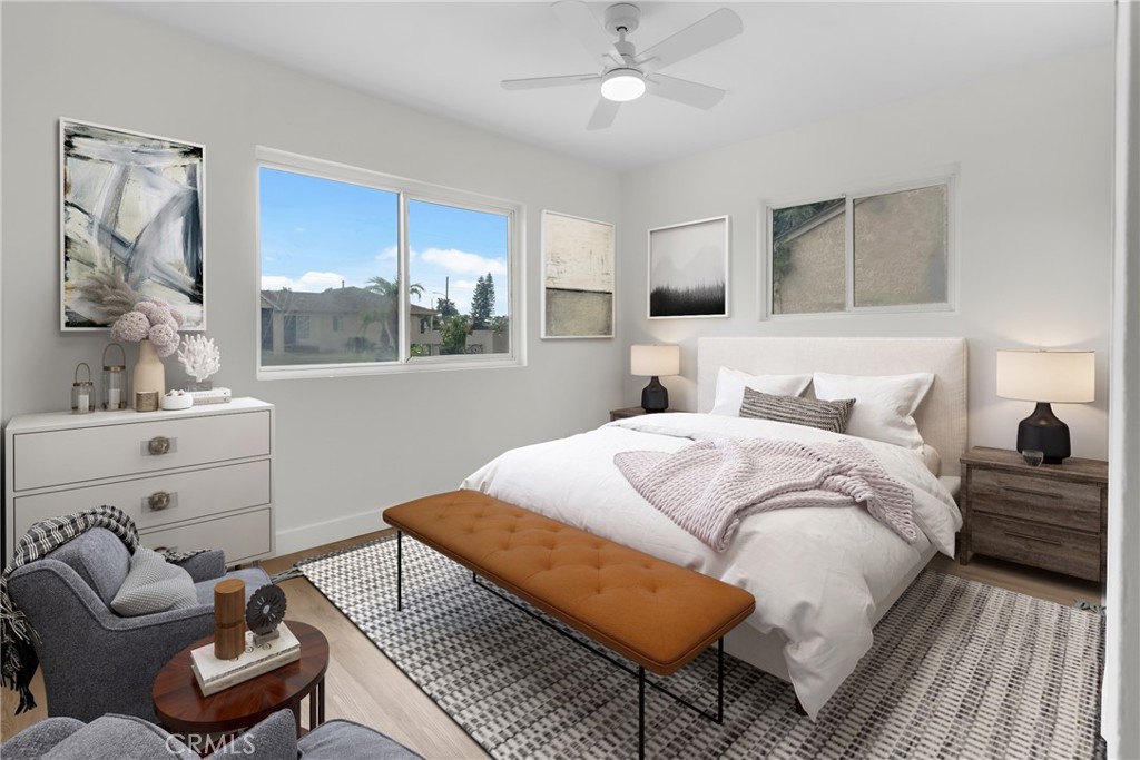 4713 Calada Avenue Pico Rivera, CA 90660 - Photo 13 of 24 a bedroom with a bed and wooden floor