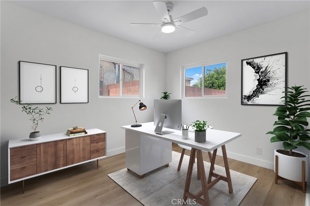 4713 Calada Avenue Pico Rivera, CA 90660 - Photo 14 of 24 a view of a dining room with furniture window and wooden floor