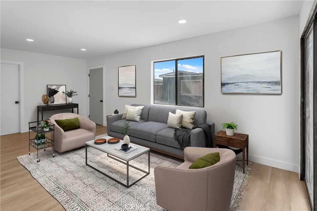 4713 Calada Avenue Pico Rivera, CA 90660 - Photo 18 of 24 a living room with furniture and a potted plant