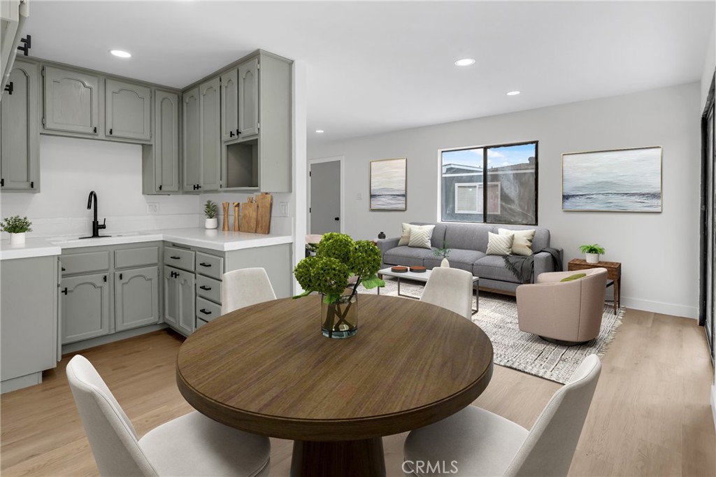 4713 Calada Avenue Pico Rivera, CA 90660 - Photo 19 of 24 a living room with kitchen island furniture and a chandelier