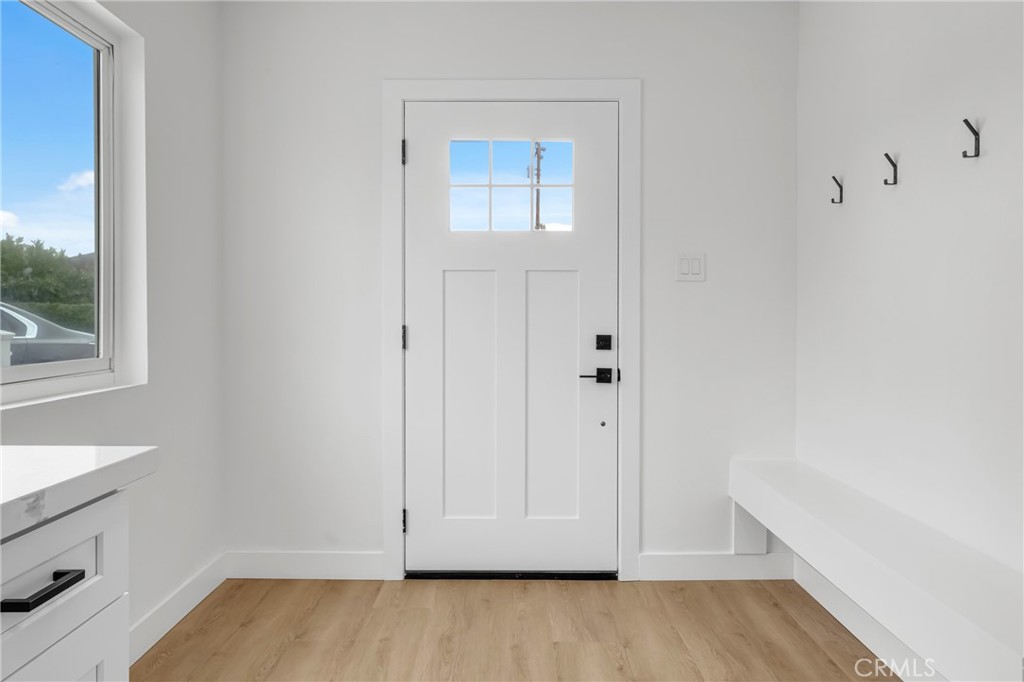 4713 Calada Avenue Pico Rivera, CA 90660 - Photo 4 of 24 a view of room with hardwood floor and window