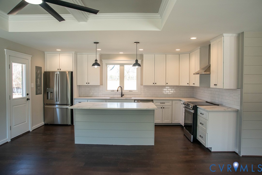 11092 Old Ridge Road Doswell, VA 23047 - Photo 24 of 63 a kitchen with stainless steel appliances granite countertop a sink stove and refrigerator