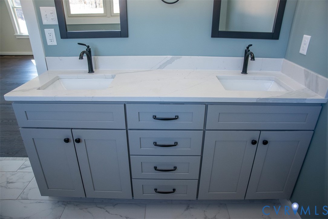 11092 Old Ridge Road Doswell, VA 23047 - Photo 34 of 63 a bathroom with a sink and a mirror