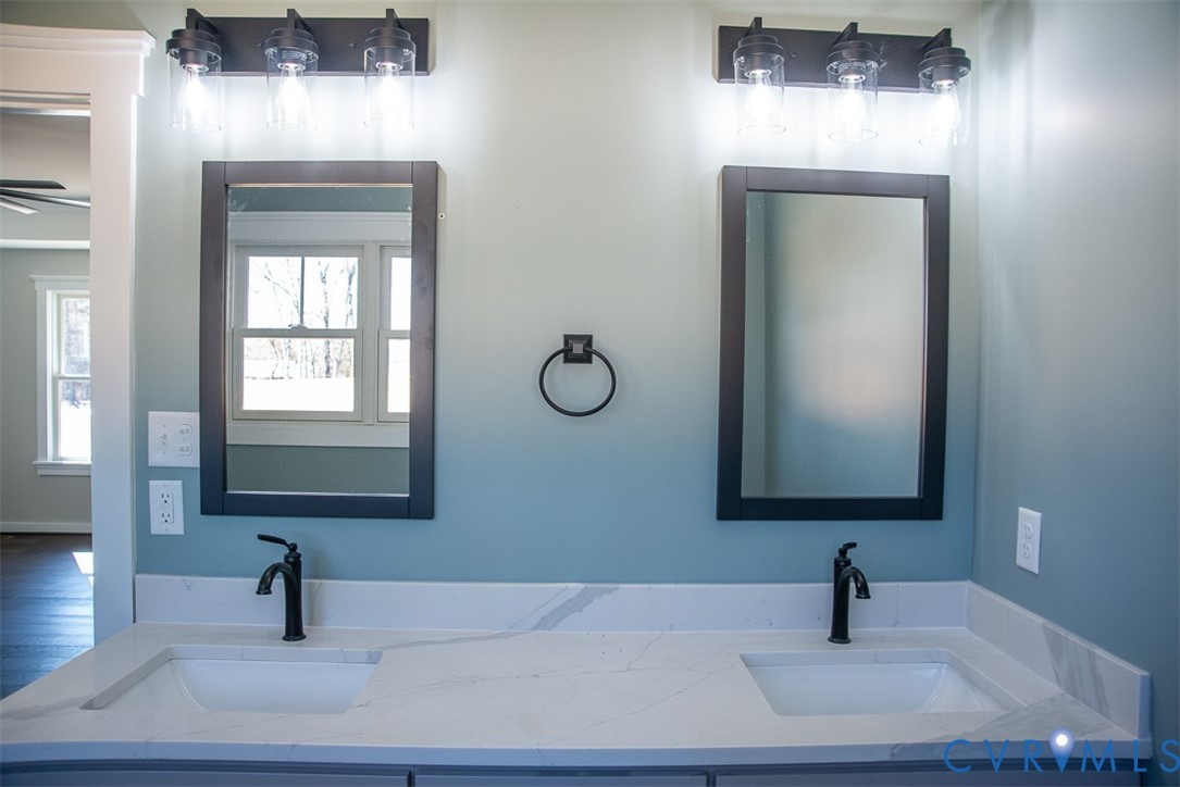 11092 Old Ridge Road Doswell, VA 23047 - Photo 35 of 63 a bathroom with a sink and a mirror