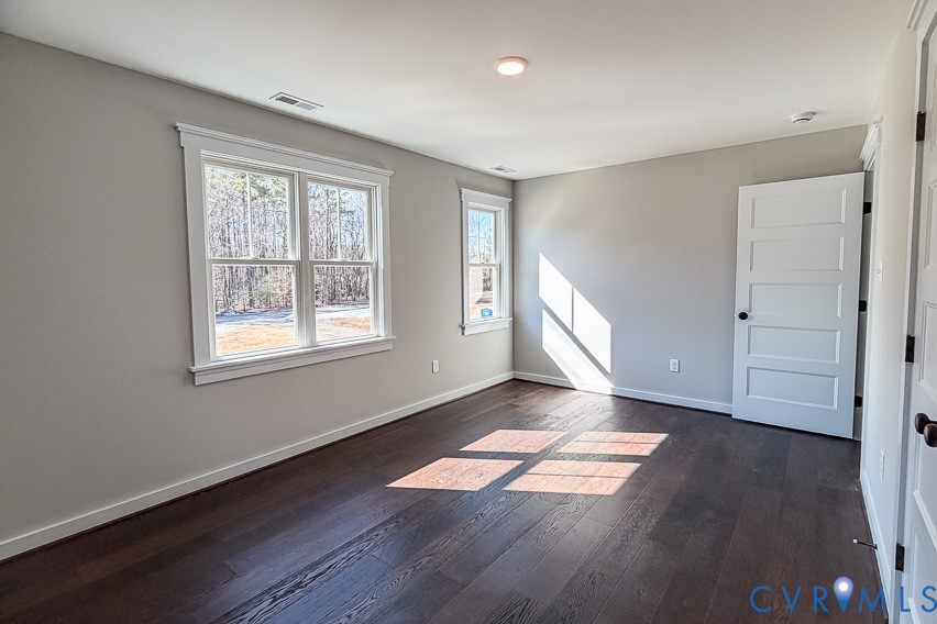 11092 Old Ridge Road Doswell, VA 23047 - Photo 49 of 63 an empty room with wooden floor and windows