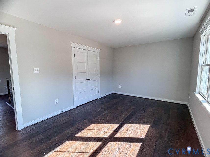 11092 Old Ridge Road Doswell, VA 23047 - Photo 51 of 63 an empty room with wooden floor and windows