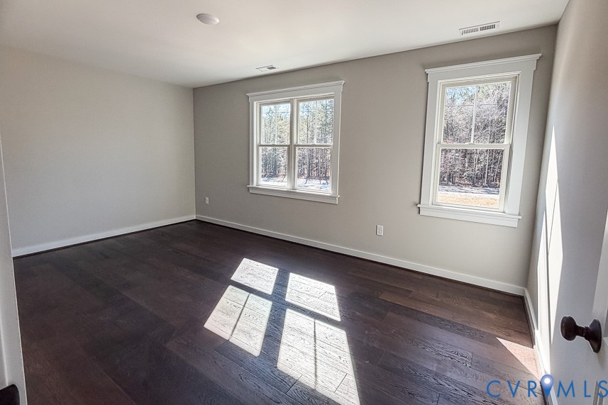 11092 Old Ridge Road Doswell, VA 23047 - Photo 52 of 63 a view of an empty room with wooden floor and a window