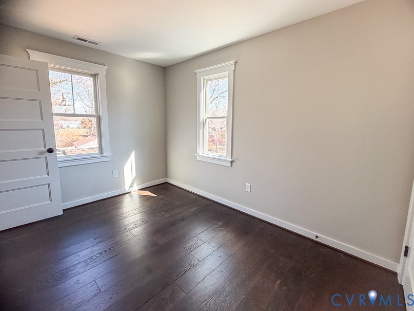 11092 Old Ridge Road Doswell, VA 23047 - Photo 54 of 63 an empty room with wooden floor and windows