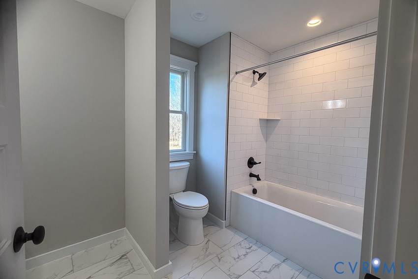 11092 Old Ridge Road Doswell, VA 23047 - Photo 59 of 63 a bathroom with a bathtub toilet and shower