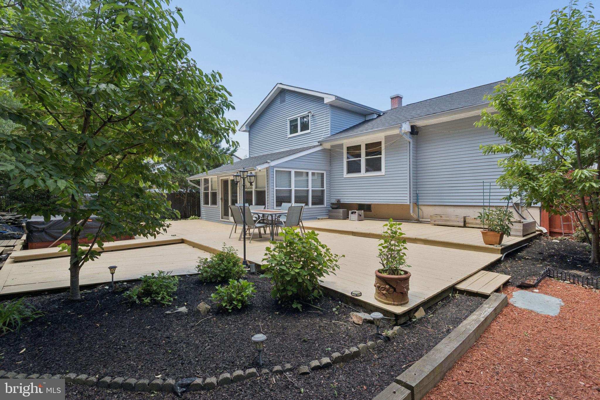 252 Sandringham Road Cherry Hill, NJ 08003 - Photo 28 of 31 a view of a house with backyard and trees in the background