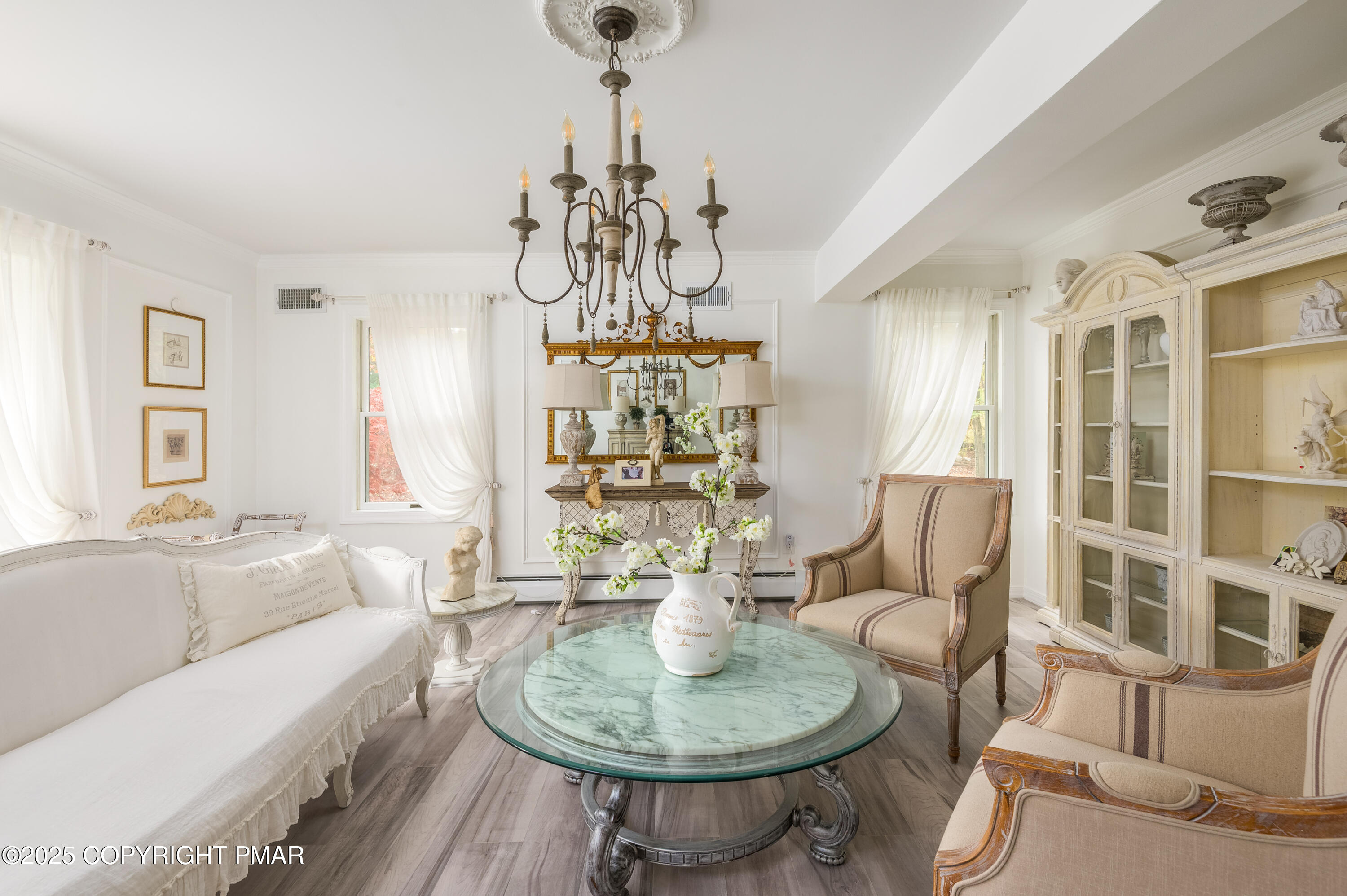 3038 Hemlock Road Stroudsburg, PA 18360 - Photo 14 of 64 a living room with furniture and a chandelier