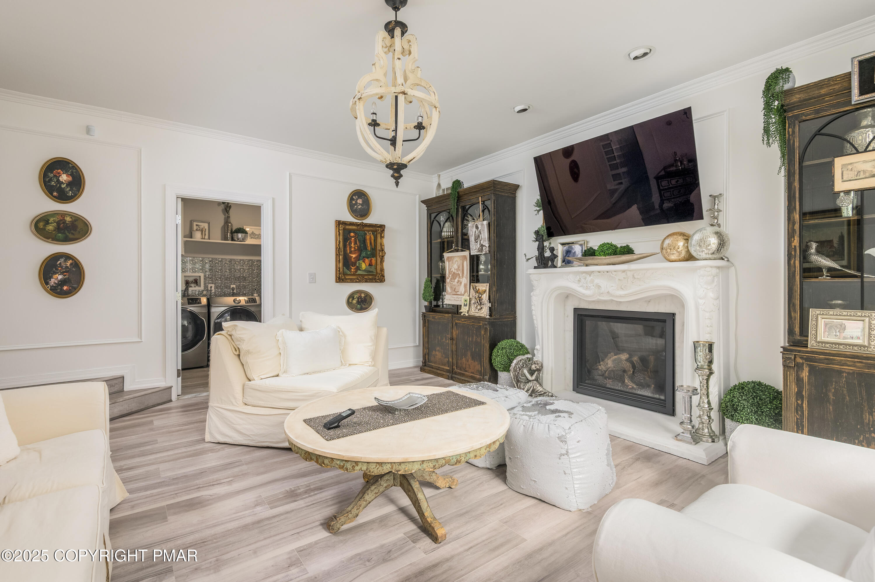 3038 Hemlock Road Stroudsburg, PA 18360 - Photo 17 of 64 a living room with furniture a fireplace and a flat screen tv
