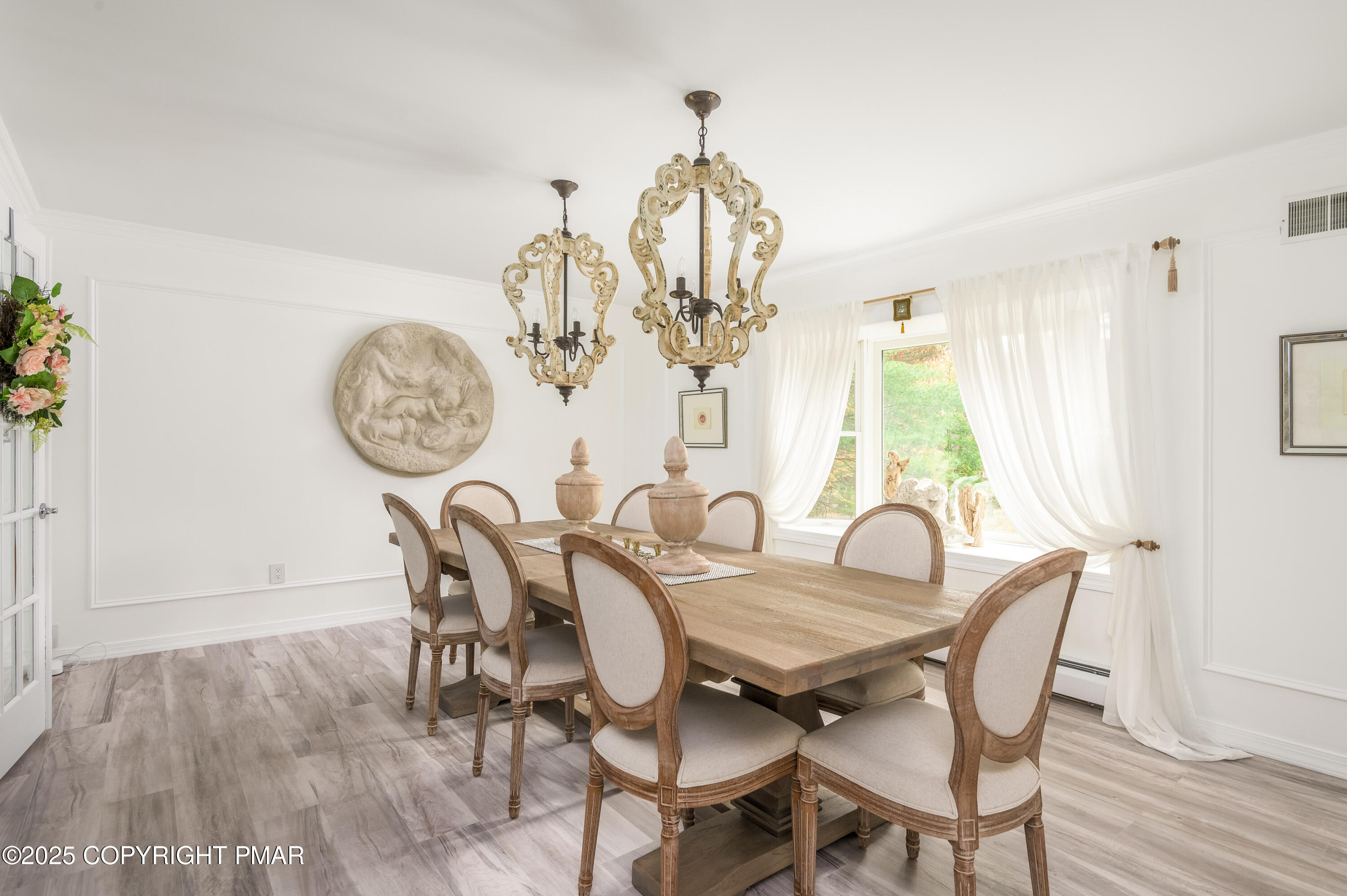 3038 Hemlock Road Stroudsburg, PA 18360 - Photo 21 of 64 a view of a dining room with furniture a chandelier and wooden floor