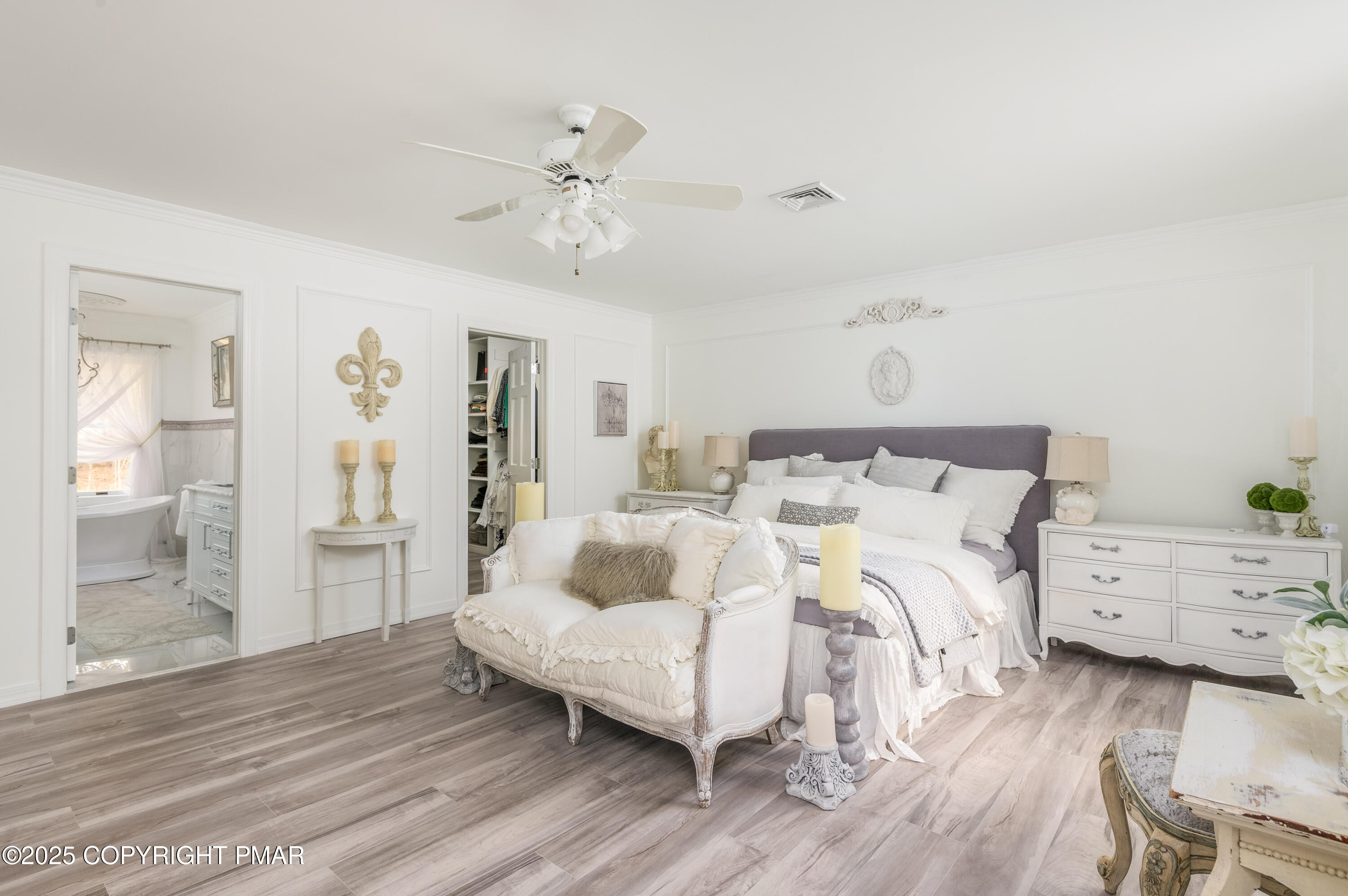 3038 Hemlock Road Stroudsburg, PA 18360 - Photo 24 of 64 a bedroom with a bed and a chandelier