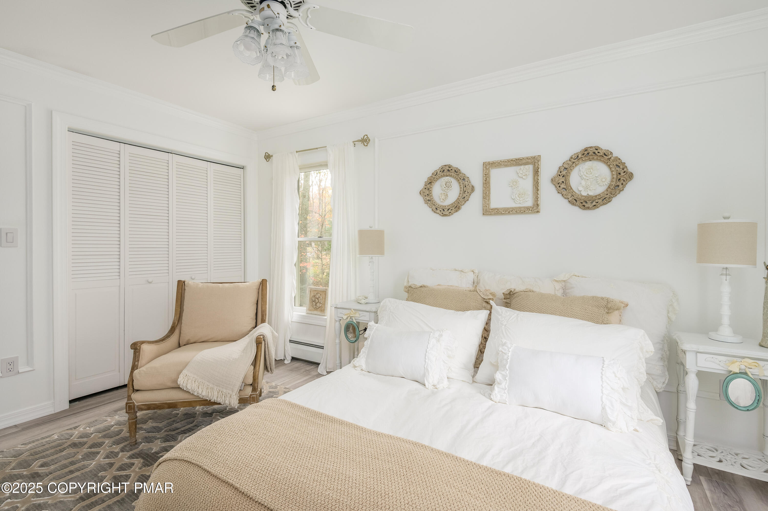 3038 Hemlock Road Stroudsburg, PA 18360 - Photo 34 of 64 a bedroom with two beds and a chandelier