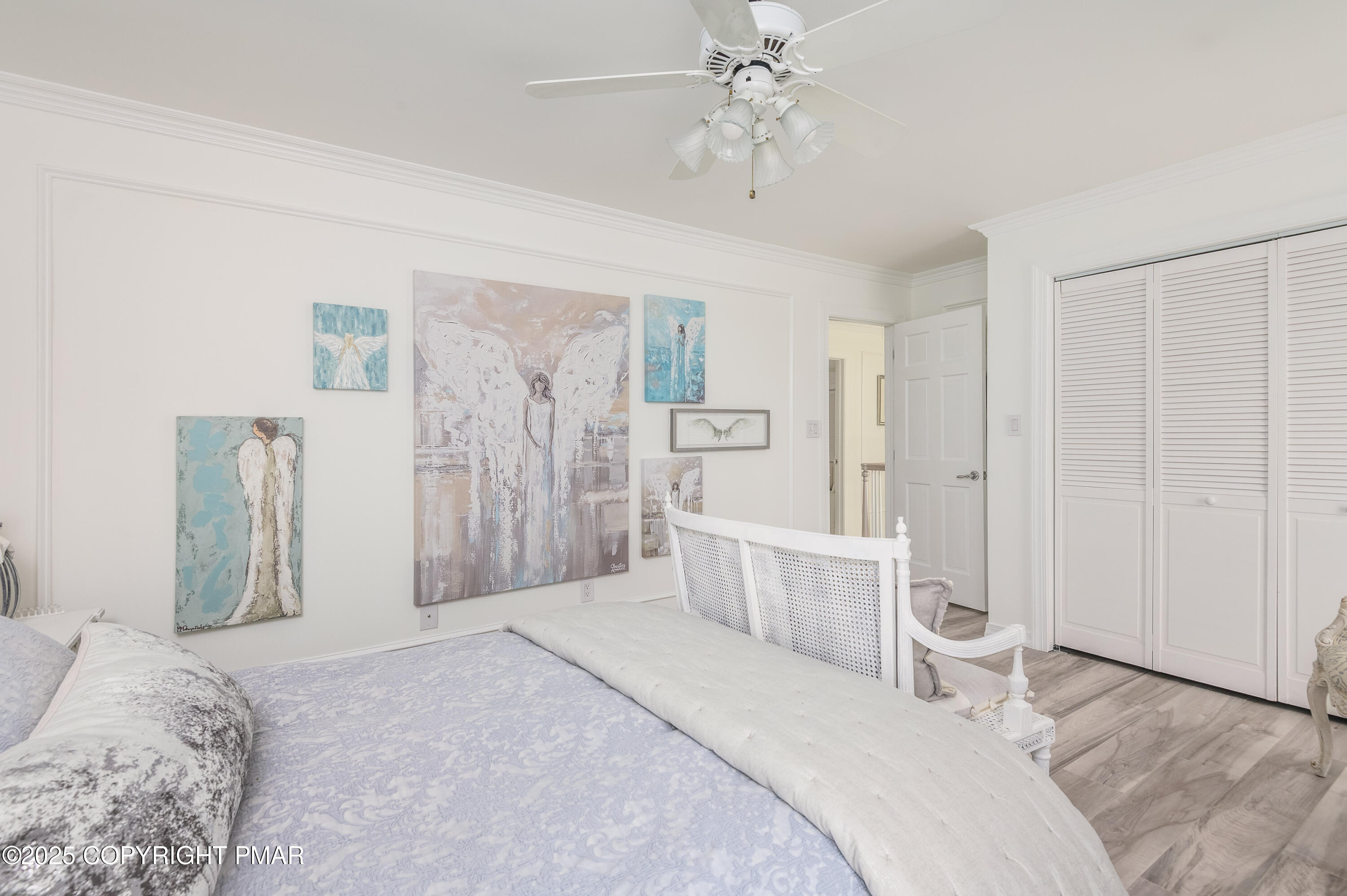 3038 Hemlock Road Stroudsburg, PA 18360 - Photo 37 of 64 a spacious bedroom with a bed and a chandelier