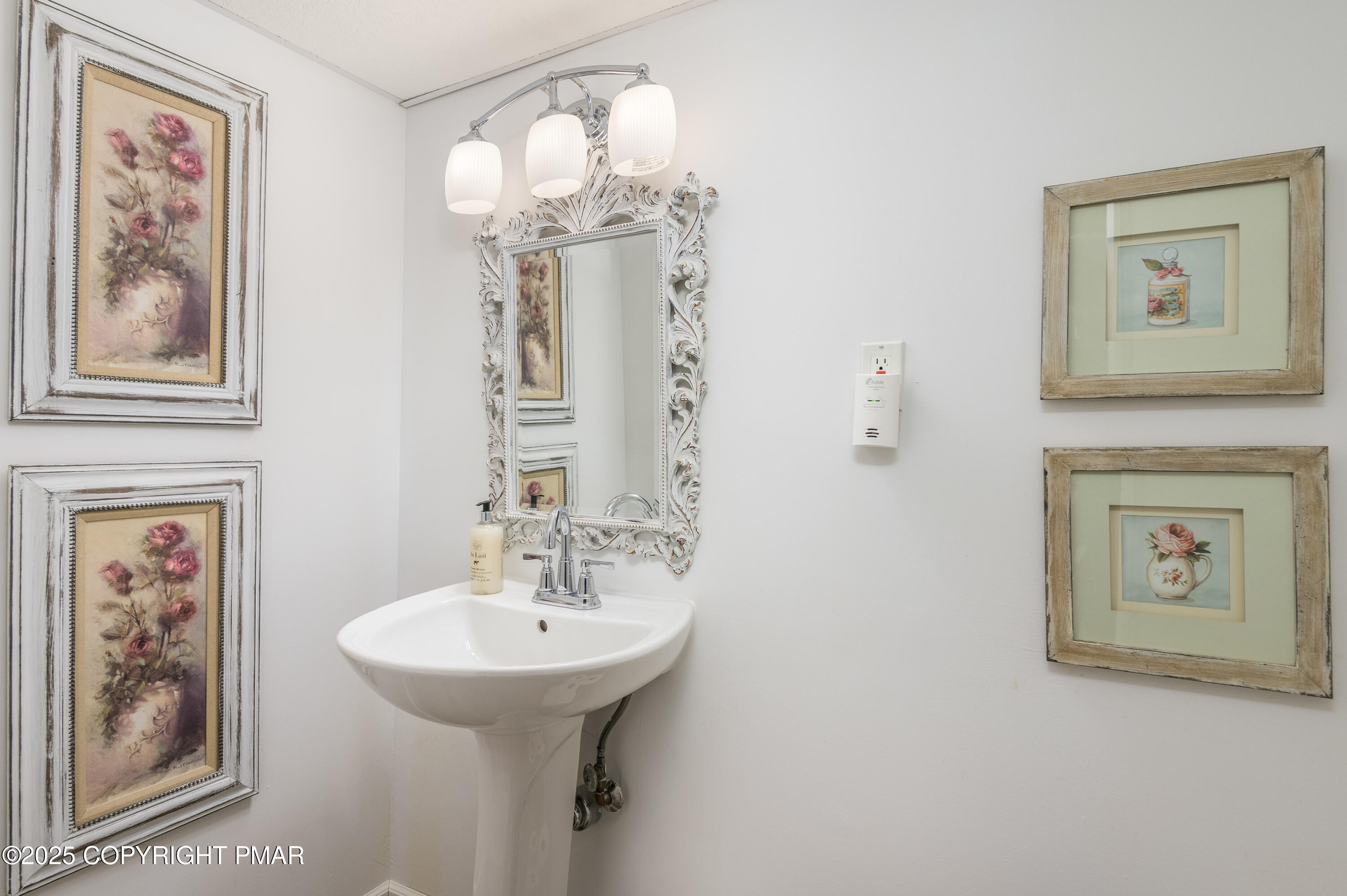 3038 Hemlock Road Stroudsburg, PA 18360 - Photo 44 of 64 a bathroom with a sink and a mirror
