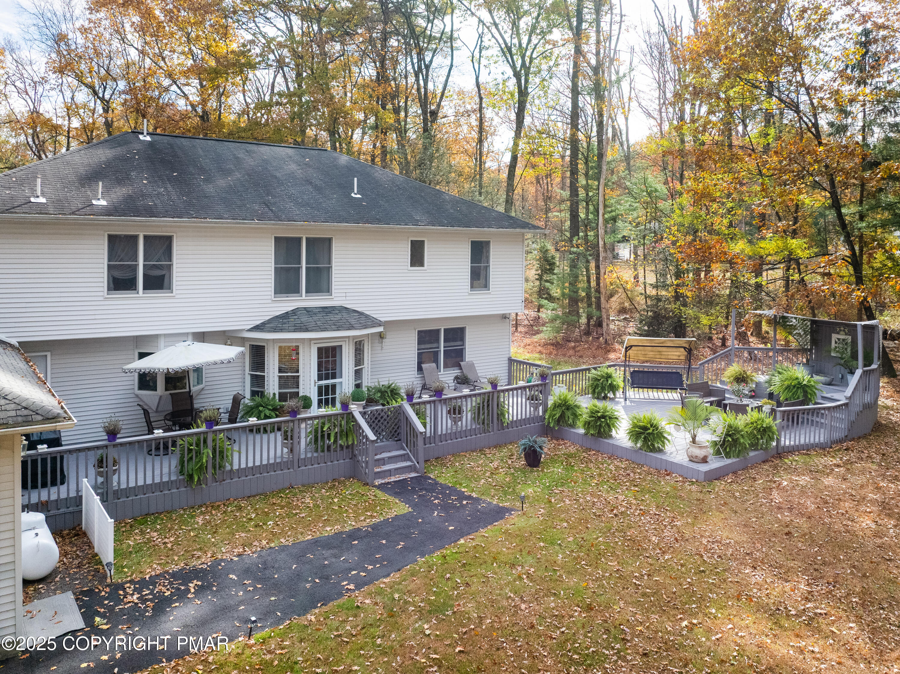 3038 Hemlock Road Stroudsburg, PA 18360 - Photo 47 of 64 a view of a house with swimming pool and sitting area