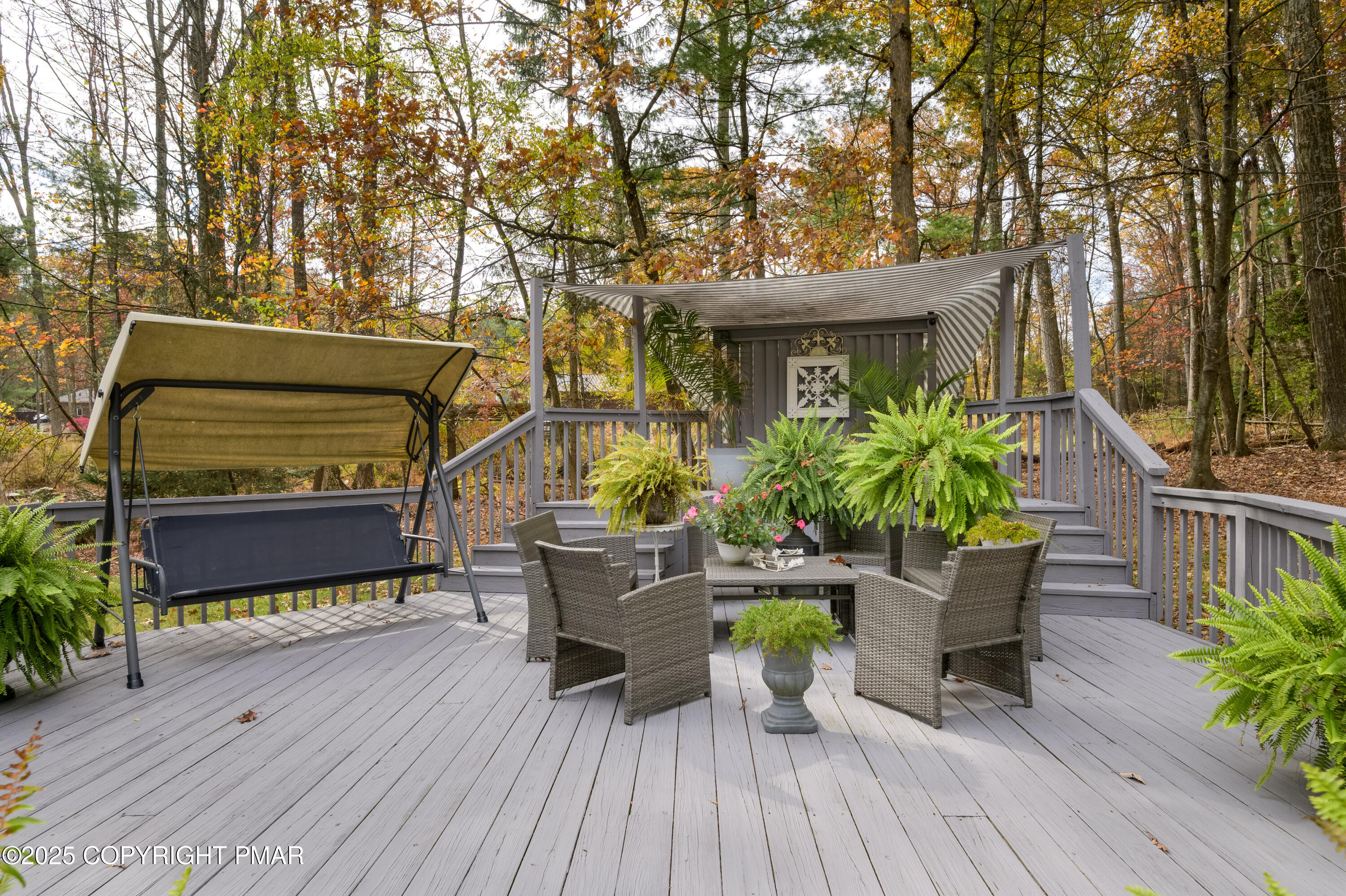 3038 Hemlock Road Stroudsburg, PA 18360 - Photo 50 of 64 a roof deck with table and chairs and potted plants