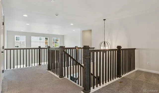 a view of a hallway with windows