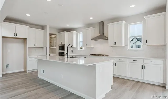 a large kitchen with cabinets