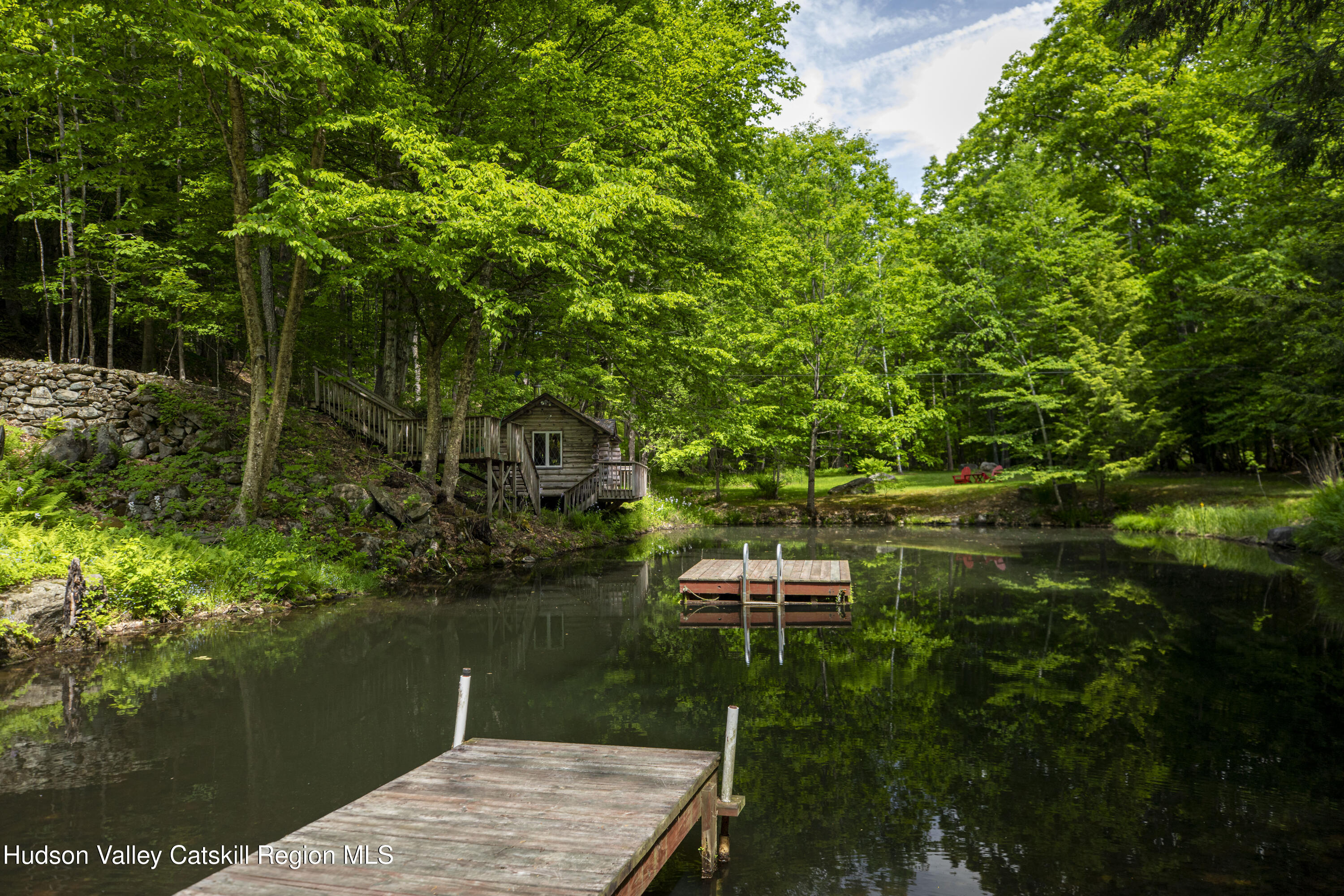 22 Old Mill Road Stephentown, NY 12169 - Photo 2 of 55 a view of a wooden floor and lake