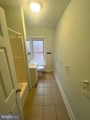 a bathroom with a sink and toilet