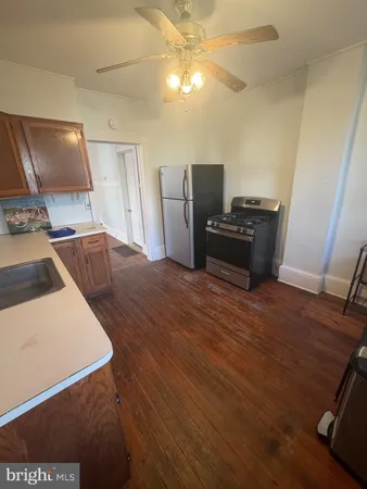 a kitchen with a stove and a refrigerator