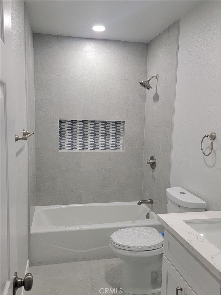 1637 Highland Street Santa Ana, CA 92703 - Photo 12 of 15 a bathroom with a sink a toilet and shower