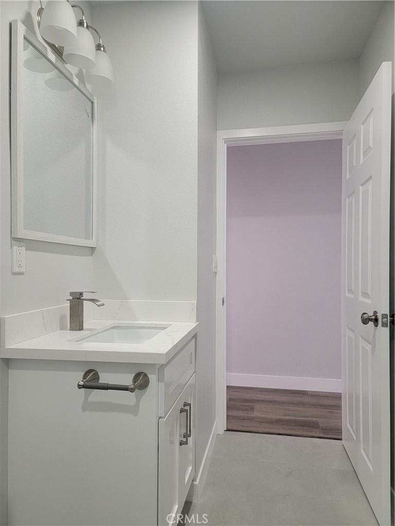 1637 Highland Street Santa Ana, CA 92703 - Photo 14 of 15 a bathroom with a sink and a mirror
