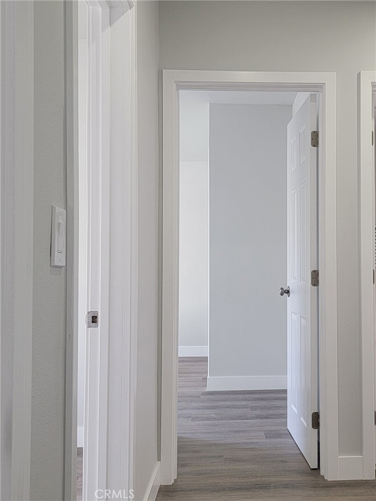1637 Highland Street Santa Ana, CA 92703 - Photo 9 of 15 a view of front door with wooden floor