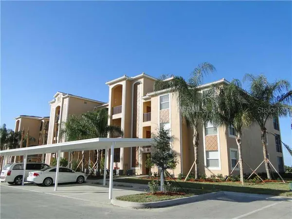 a view of a building with a palm tree