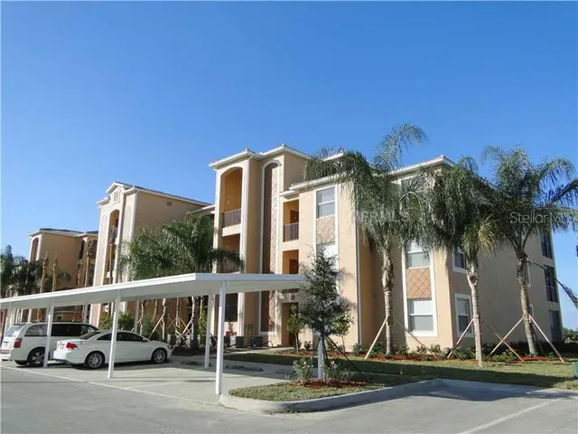 a view of a building with a palm tree