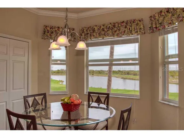 a kitchen with a table and chairs