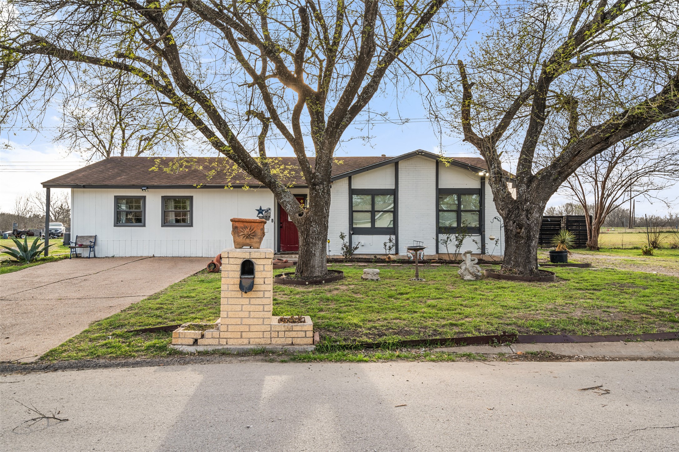 10505 Ruidosa Street Austin, TX 78719 - Photo 1 of 1 View of front of house with driveway and a front lawn