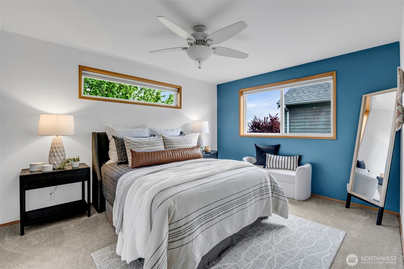 722 North 92nd Street, Unit 1 Seattle, WA 98103 - Photo 15 of 33 a bedroom with bed and a large mirror