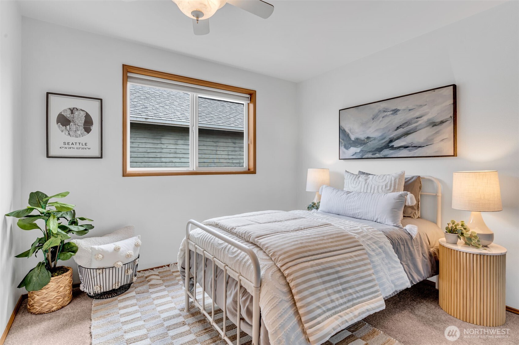 722 North 92nd Street, Unit 1 Seattle, WA 98103 - Photo 22 of 33 a bedroom with a bed and a potted plant