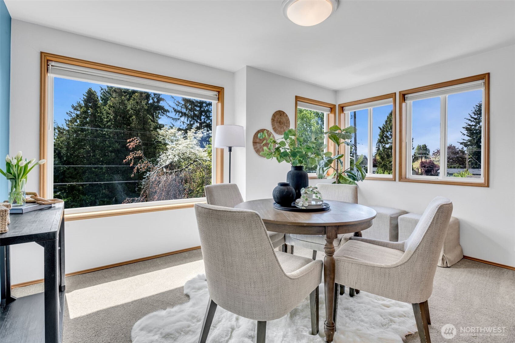 722 North 92nd Street, Unit 1 Seattle, WA 98103 - Photo 7 of 33 a view of a dining room with furniture window and outside view