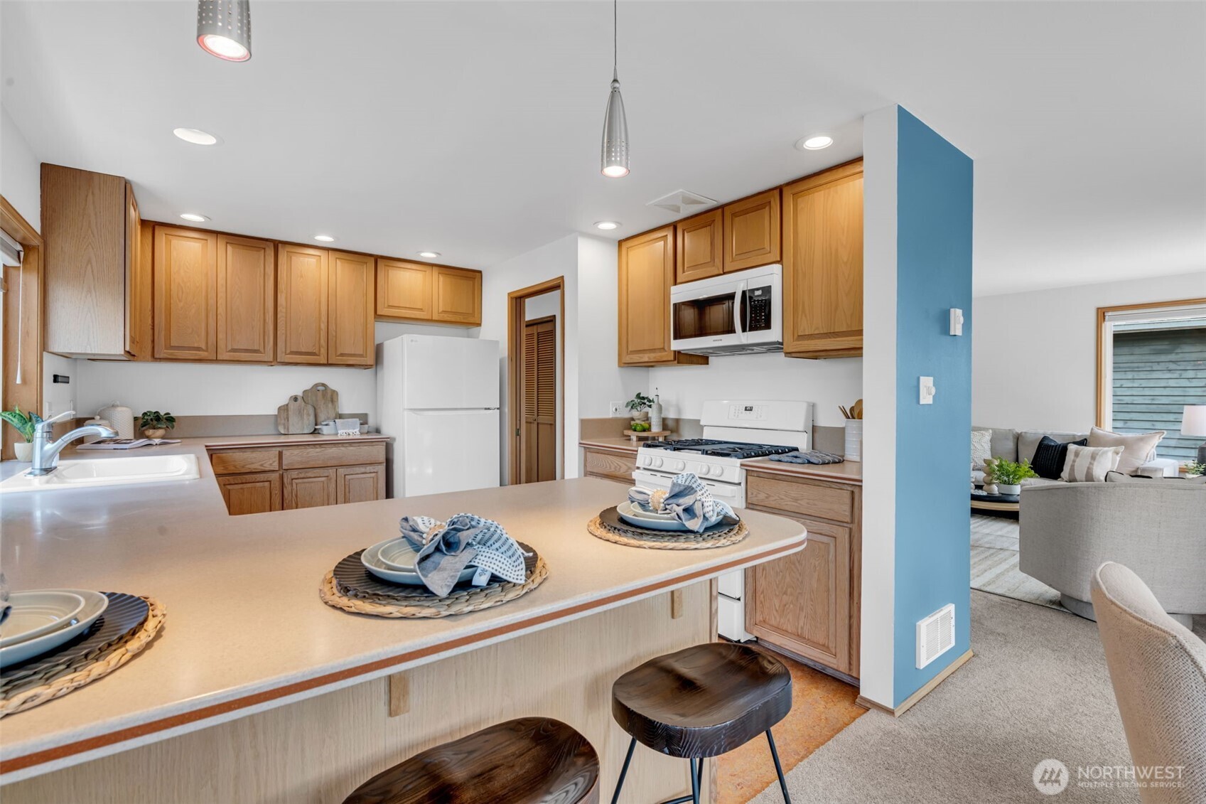 722 North 92nd Street, Unit 1 Seattle, WA 98103 - Photo 9 of 33 a kitchen with a sink stove and refrigerator