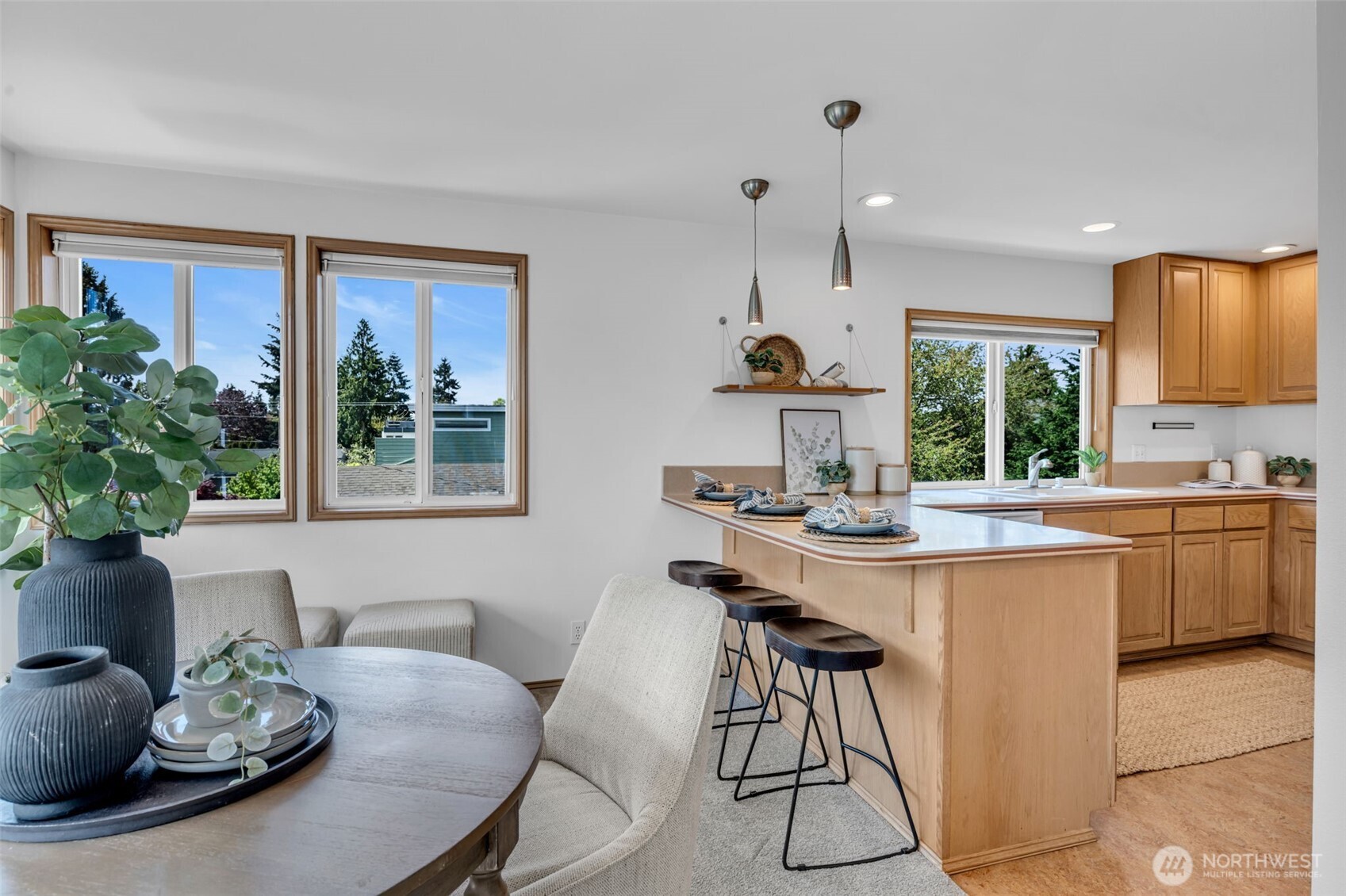 722 North 92nd Street, Unit 1 Seattle, WA 98103 - Photo 10 of 33 a kitchen with a table and chairs in it