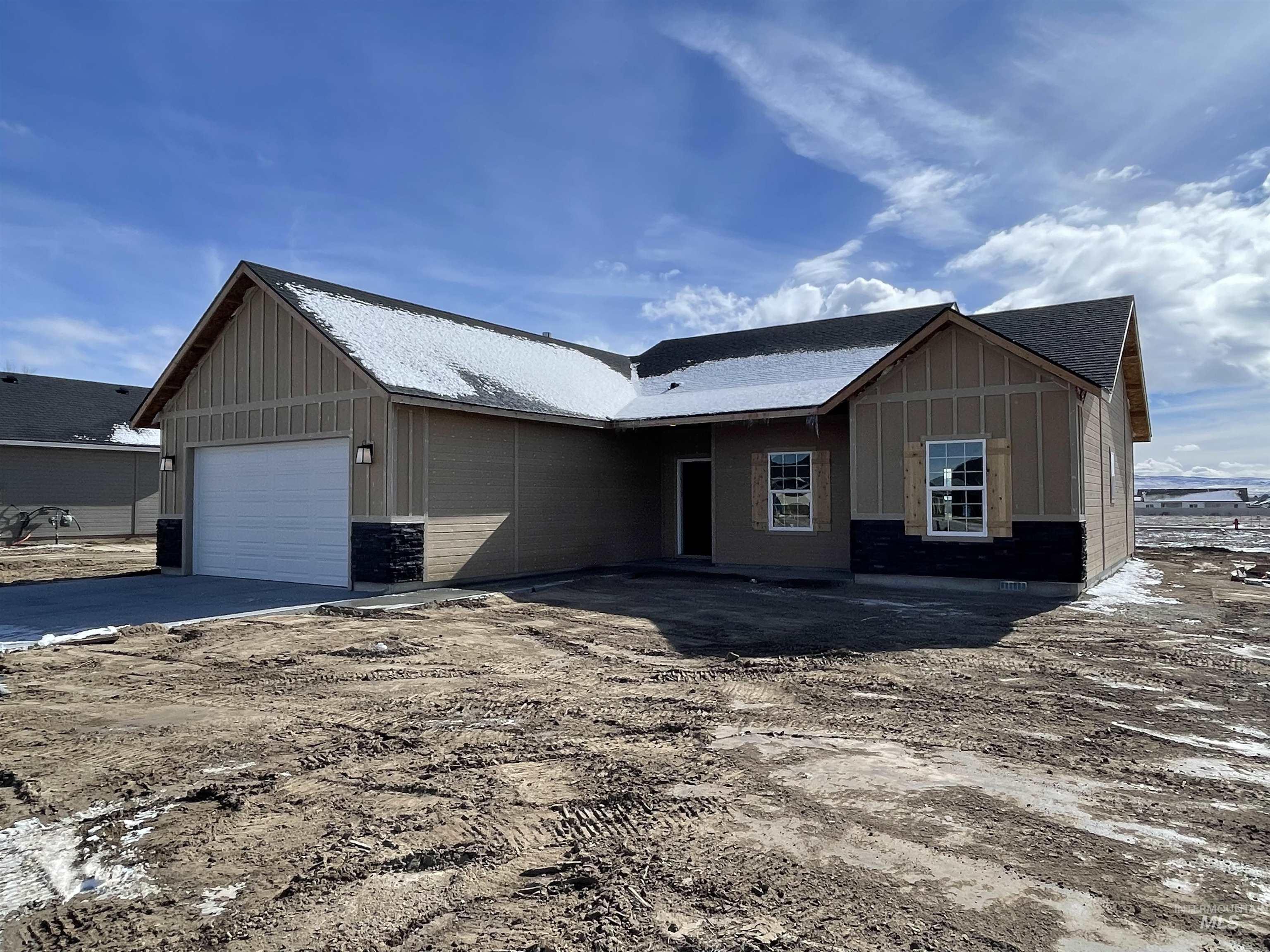 961 Quartz Road Kimberly, ID 83341 - Photo 1 of 19 View of front of home with board and batten siding, an attached garage, and driveway