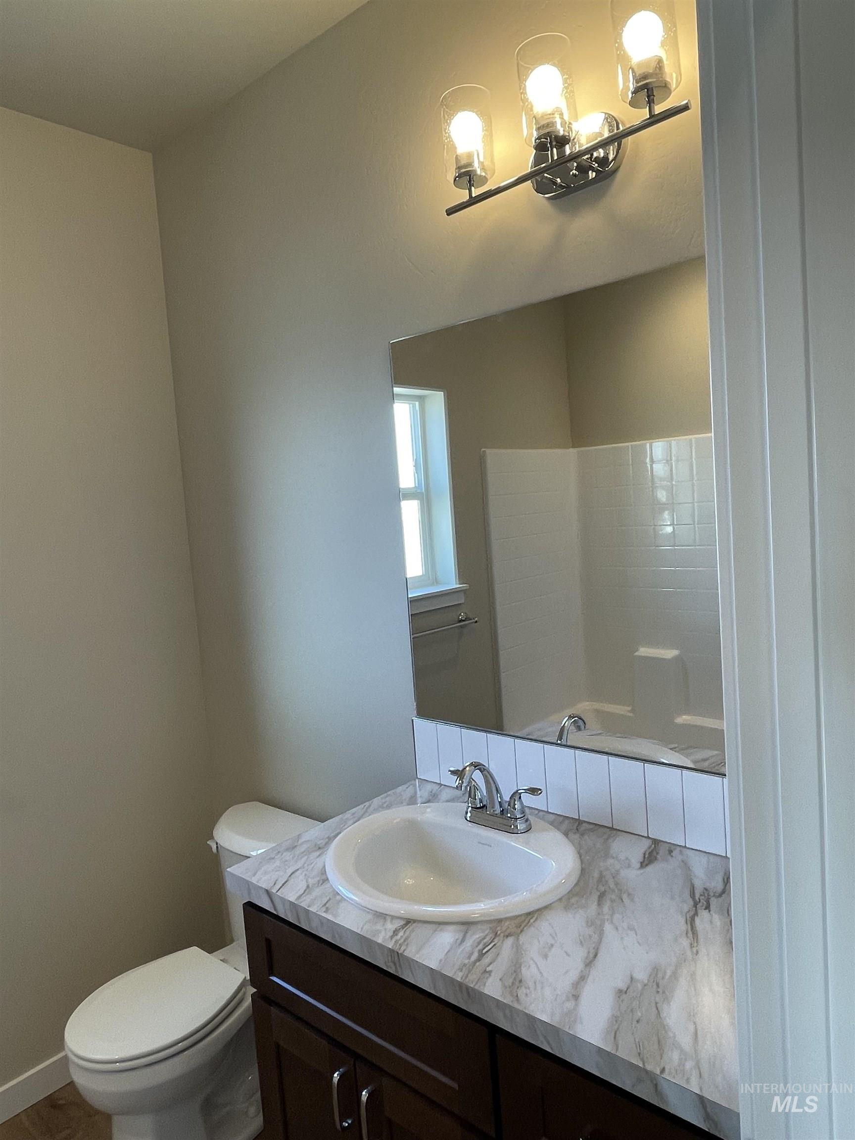 961 Quartz Road Kimberly, ID 83341 - Photo 16 of 19 Bathroom featuring vanity and toilet