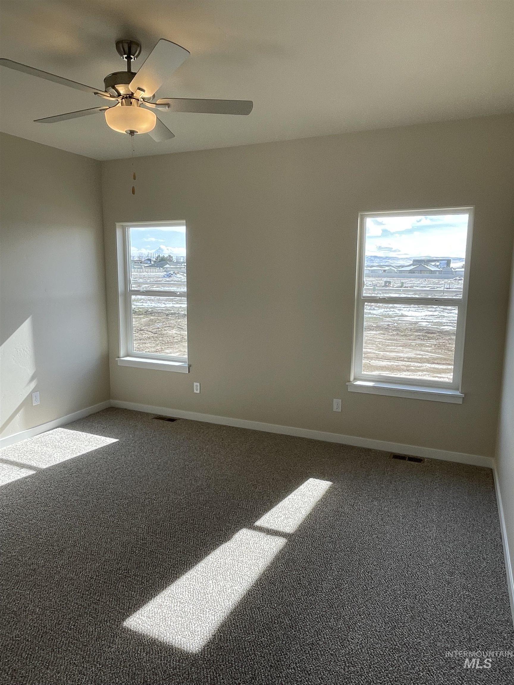 961 Quartz Road Kimberly, ID 83341 - Photo 7 of 19 Carpeted empty room featuring baseboards and ceiling fan