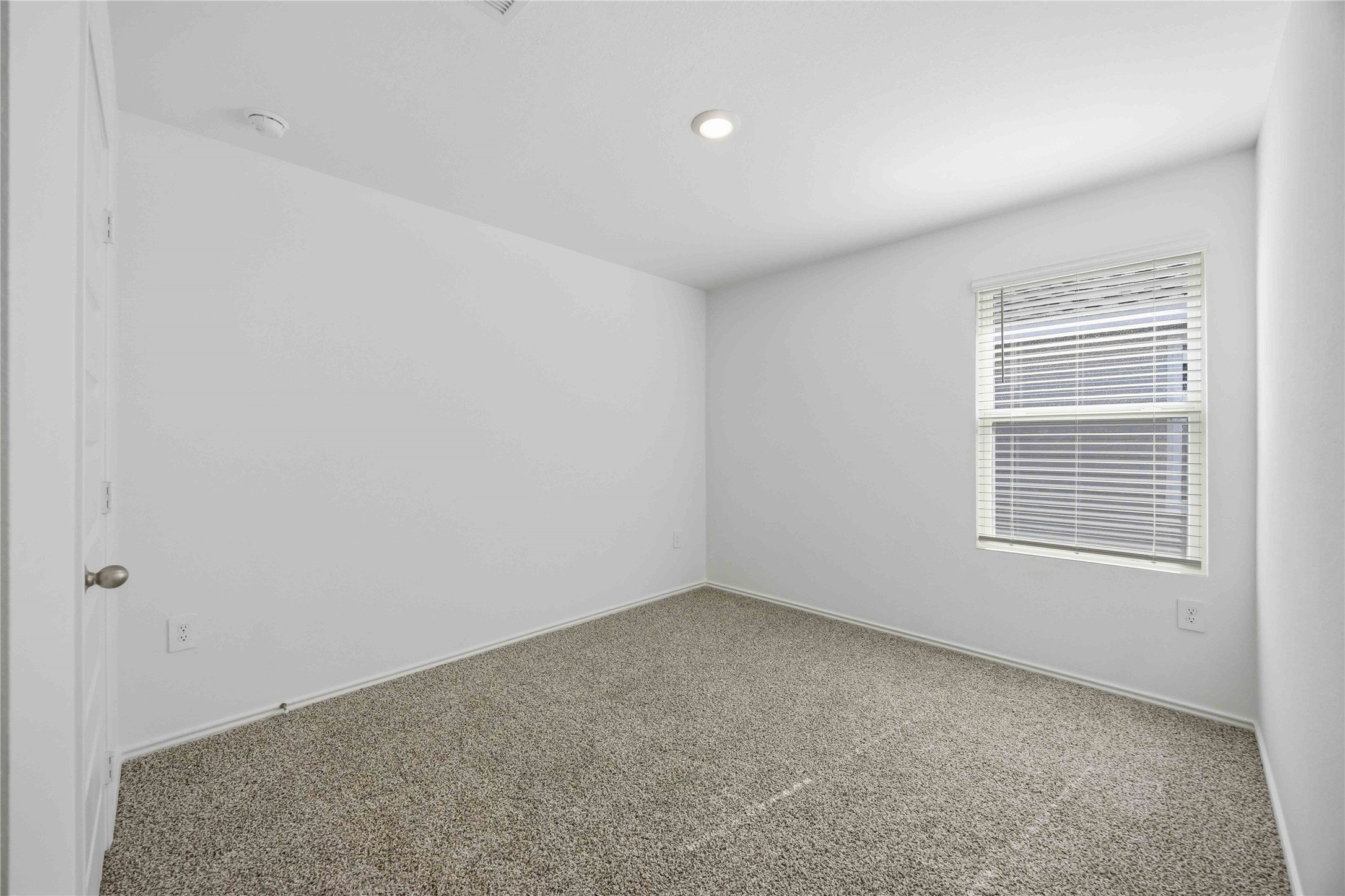 11908 Lilac Ice Lane Houston, TX 77048 - Photo 15 of 16 a view of an empty room with a window